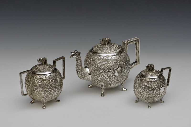 A tea service made of embossed Indian silver; gifted to College by the Librarian in 2015  