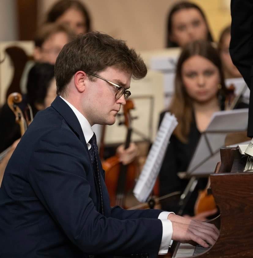 Alfred Fardell playing piano