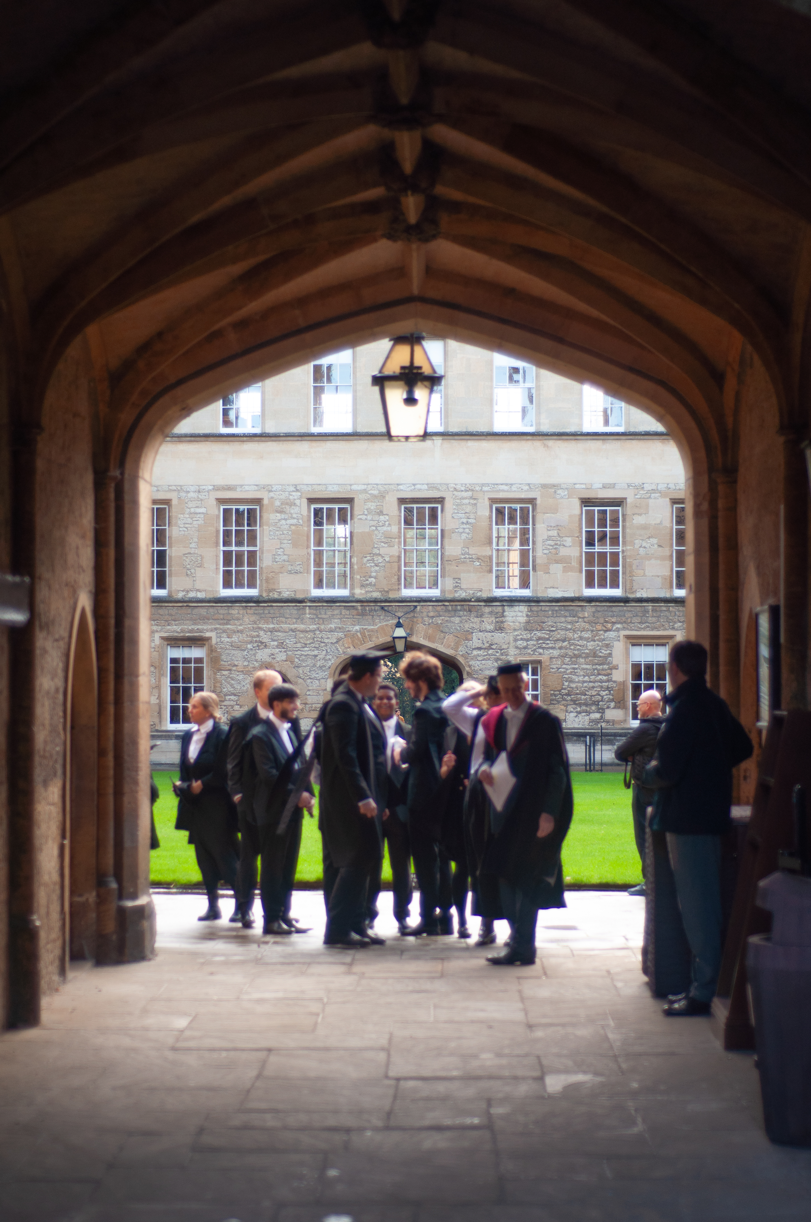 Silhouette of Matriculands through archway 