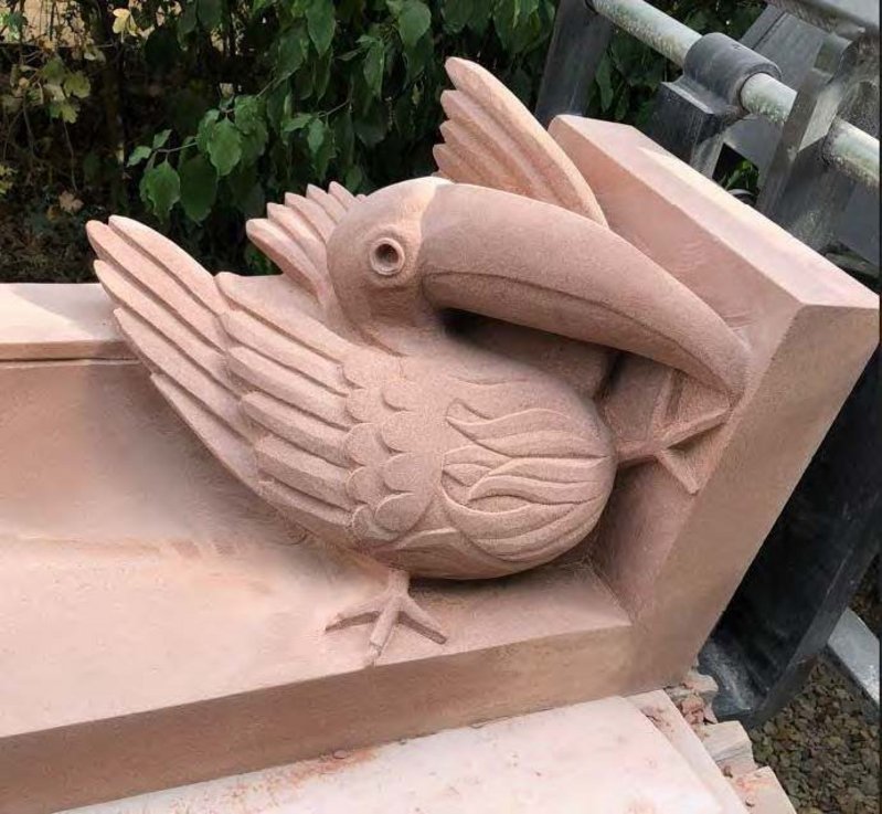 Stone-carved gargoyle of a pelican