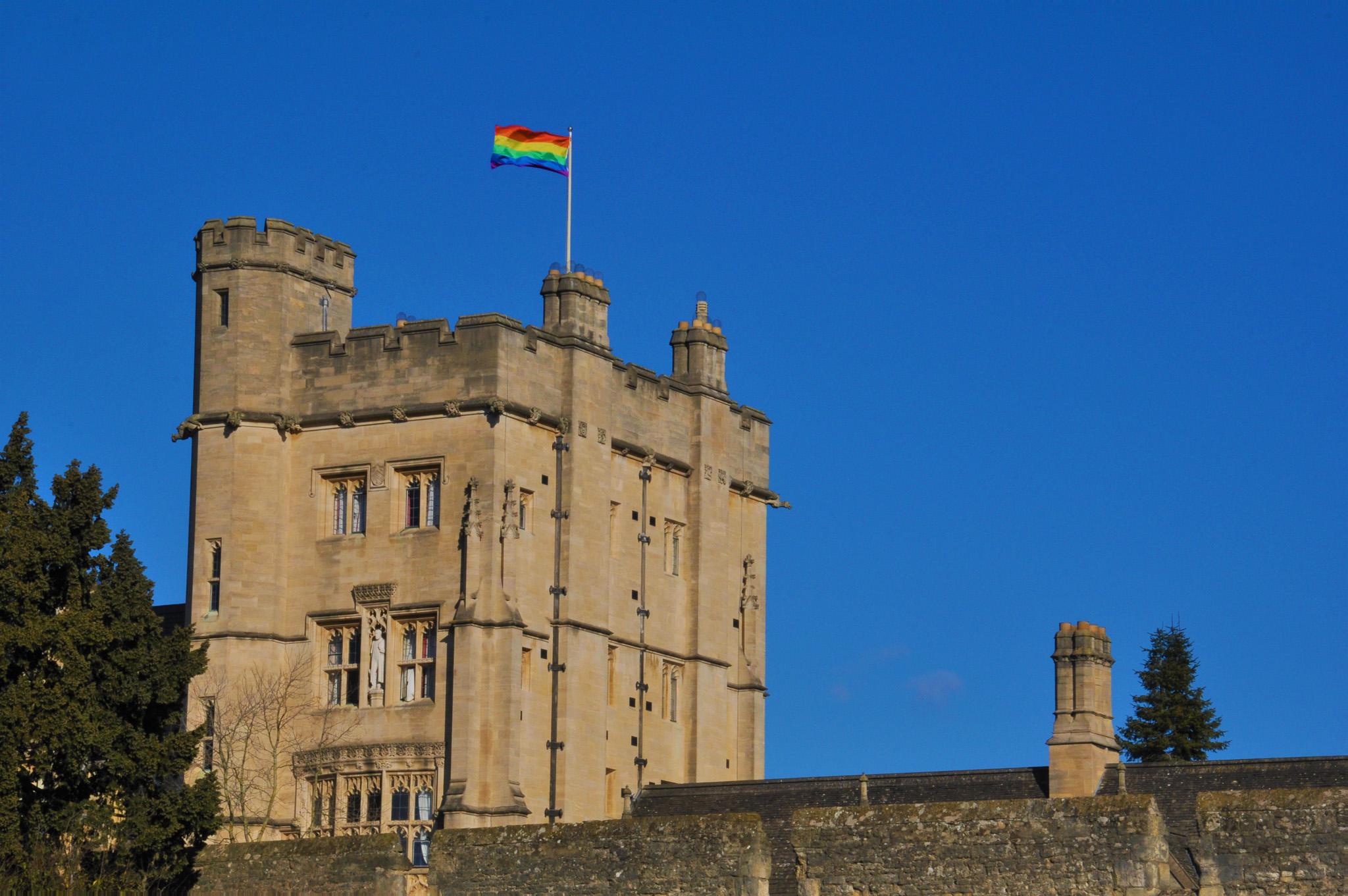 Rainbow flag flying over New College's Robinson Tower