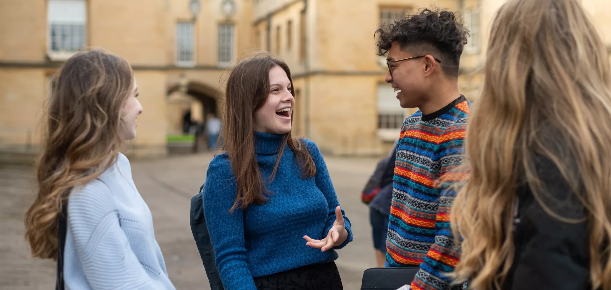 A group of New College students in Garden Quad