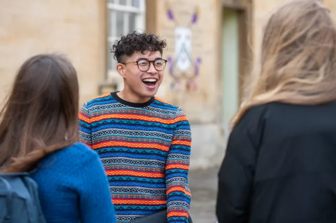 A laughing student in Garden Quad