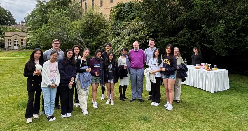 Students from ISF School in Hong Kong pose for a picture with the Warden in his garden