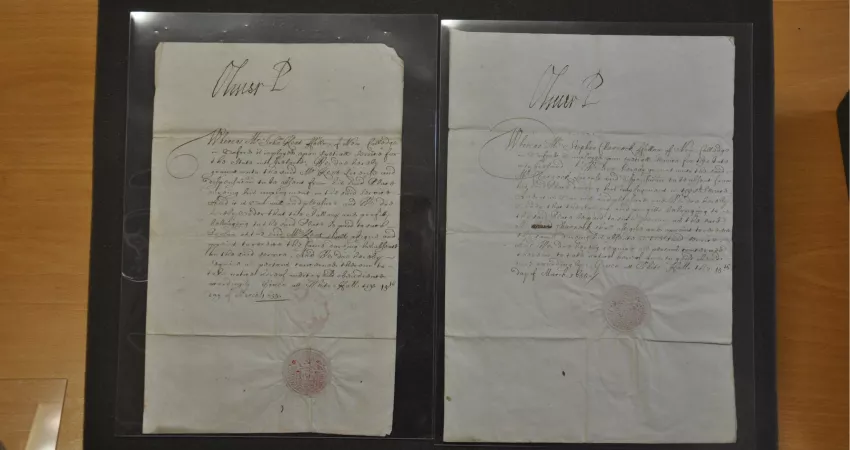 Two old documents featuring handwritten text