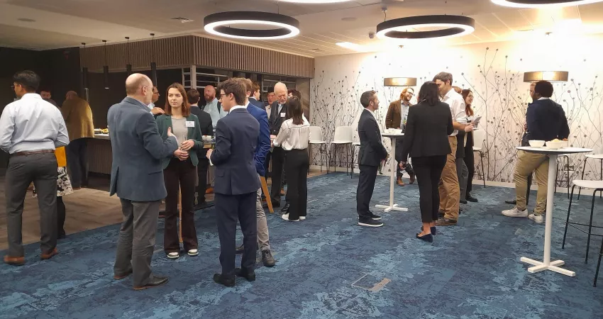 A group of guests chat at the City & Professional Network Drinks