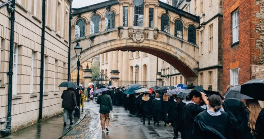 Graduands with Bridge of Sighs in the background