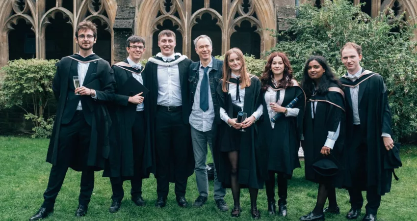 Graduates posing together