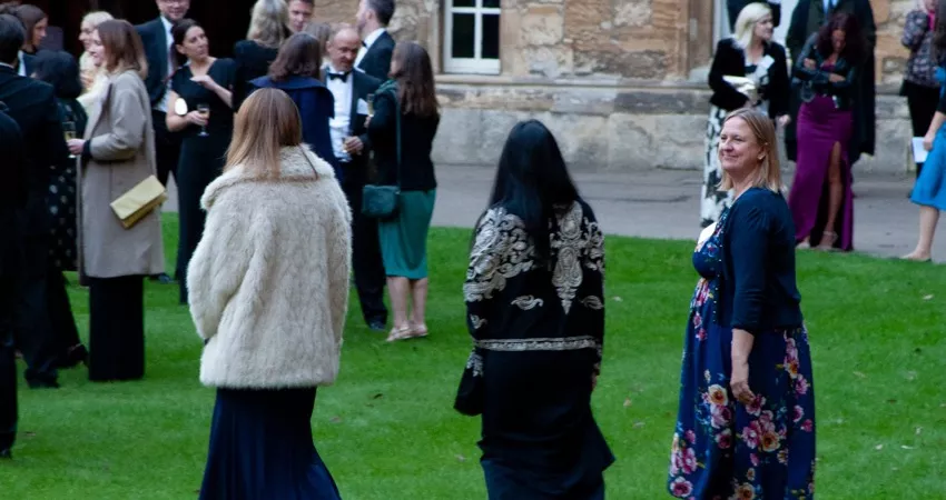 Old Members walking in Front Quad 