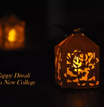 Small lantern containing a tea light, with the words 'Happy Diwali from New College' alongside